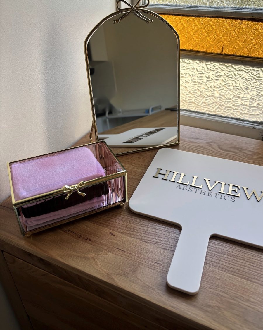 A Hillview Aesthetics hand mirror in the treatment room